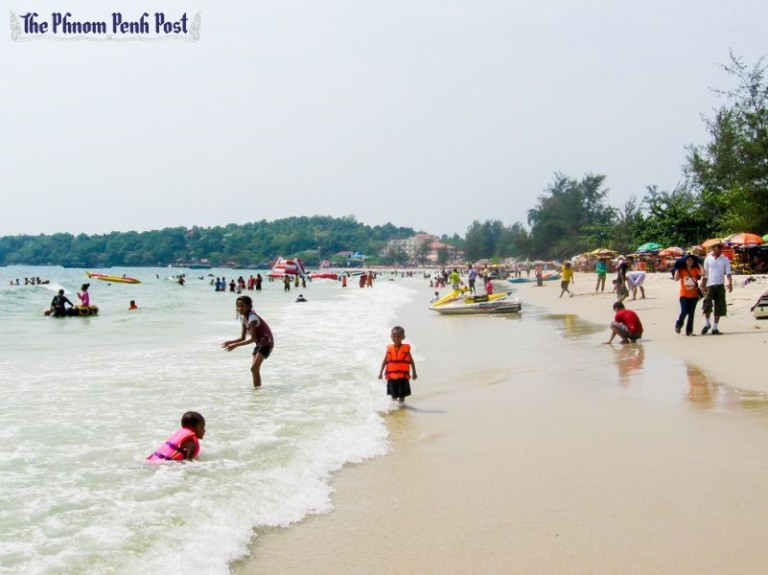 People relax at a beach in Sihanoukville in 2013. The National Committee for Cambodia Bay Management and Development issued a statement earlier this week calling for developers to abide by a 50-metre construction-free zone from the shoreline