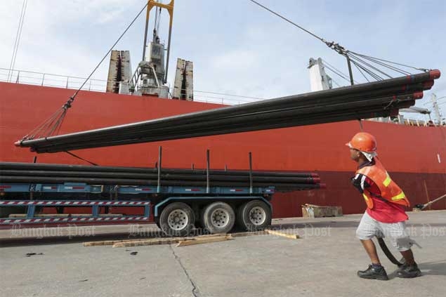 A worker unloads steel products imported from China. To avoid competition with cheap Chinese steel, The Steel Plc is branching into the power-generating sector. 