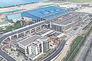 A bird's-eye view of the new passenger terminal (with blue roof), a key part of Phuket airport's long-delayed expansion. 