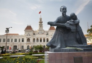  A statue of Ho Chi Minh stands in front of the City Hall building.