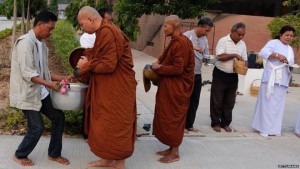 Monks at Nakhon Ratchasima mark Magha Puja festivalImage copyright Matthew Richards/Pacific Press/LightRocket/Getty 