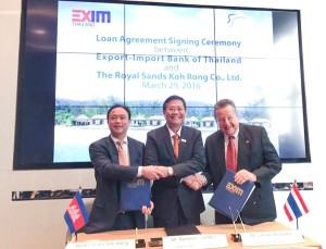 Kematat Saicheur (C), acting president of Export-Import Bank of Thailand, shakes hand with Kith Meng (L) and Lersan Misitsakul, Director of Royal ong Co., Ltd after sealing the loan agreement.