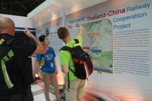 Visitors look at an exhibition board at Hua Lamphong station showing details of the Sino-Thai high-speed rail project. Officials of both countries will meet this month to hammer out plans for the scheme.