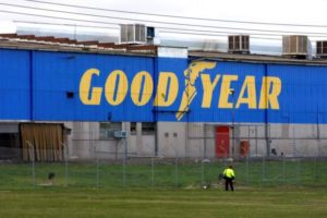 A man walks past the Goodyear logo at the South Pacific Tyres facility in Somerton, Victoria, Melbourne
