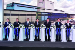 Posco CEO Kwon Oh-joon, center, and other officials including Thailand’s foreign minister Thanasak Patimaprakorn, third from right, celebrate its new manufacturing facility for automotive steel sheets in Rayong, Thailand, on Wednesday.